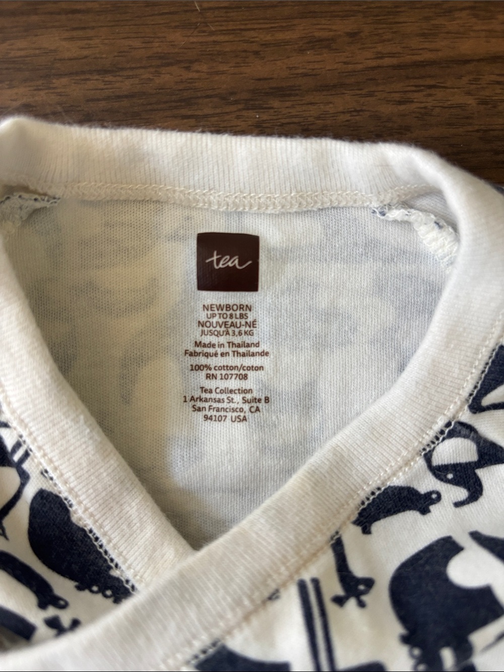 Tea Collection Ivory One-Piece with Navy Animal Print - Picture 2 of 3